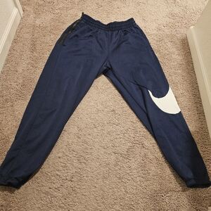 Navy blue sweats.